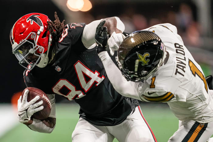 Nov 26, 2023; Atlanta, Georgia, USA; Atlanta Falcons running back Cordarrelle Patterson (84) is hit by New Orleans Saints cornerback Alontae Taylor (1) during the second half at Mercedes-Benz Stadium. Mandatory Credit: Dale Zanine-USA TODAY Sports